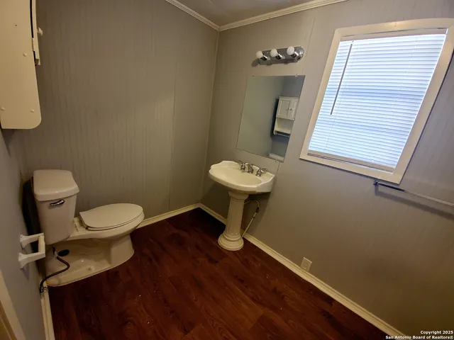 a bathroom with a toilet and a sink