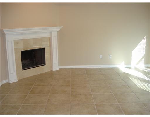 6846 Round Table Street Corpus Christi, TX 78414 - Photo 3 of 3 a view of an empty room with a fireplace and a window