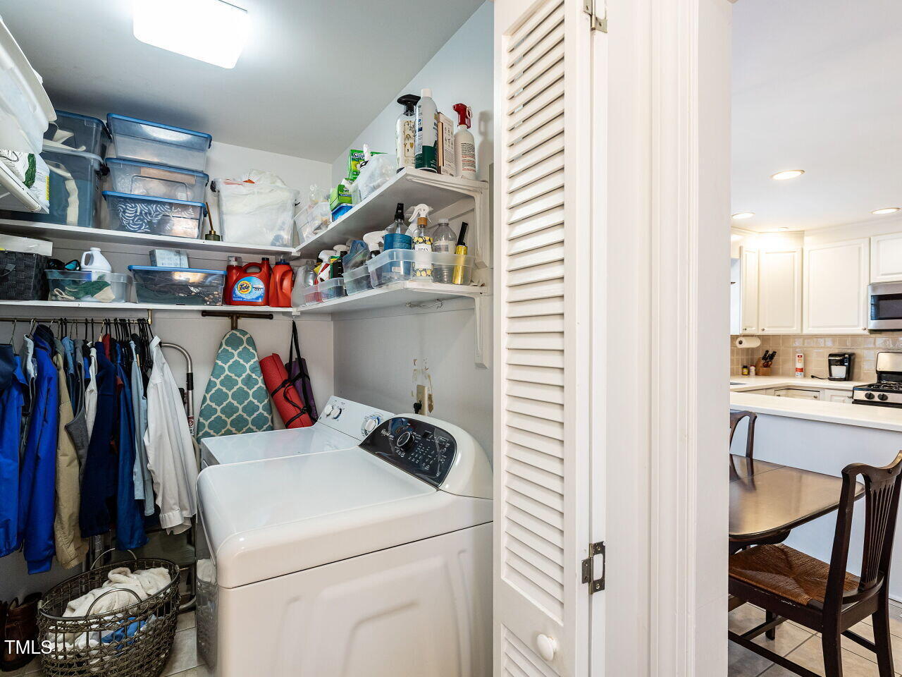 3209 Northampton Street Raleigh, NC 27609 - Photo 20 of 31 a view of storage and utility room with washer and dryer