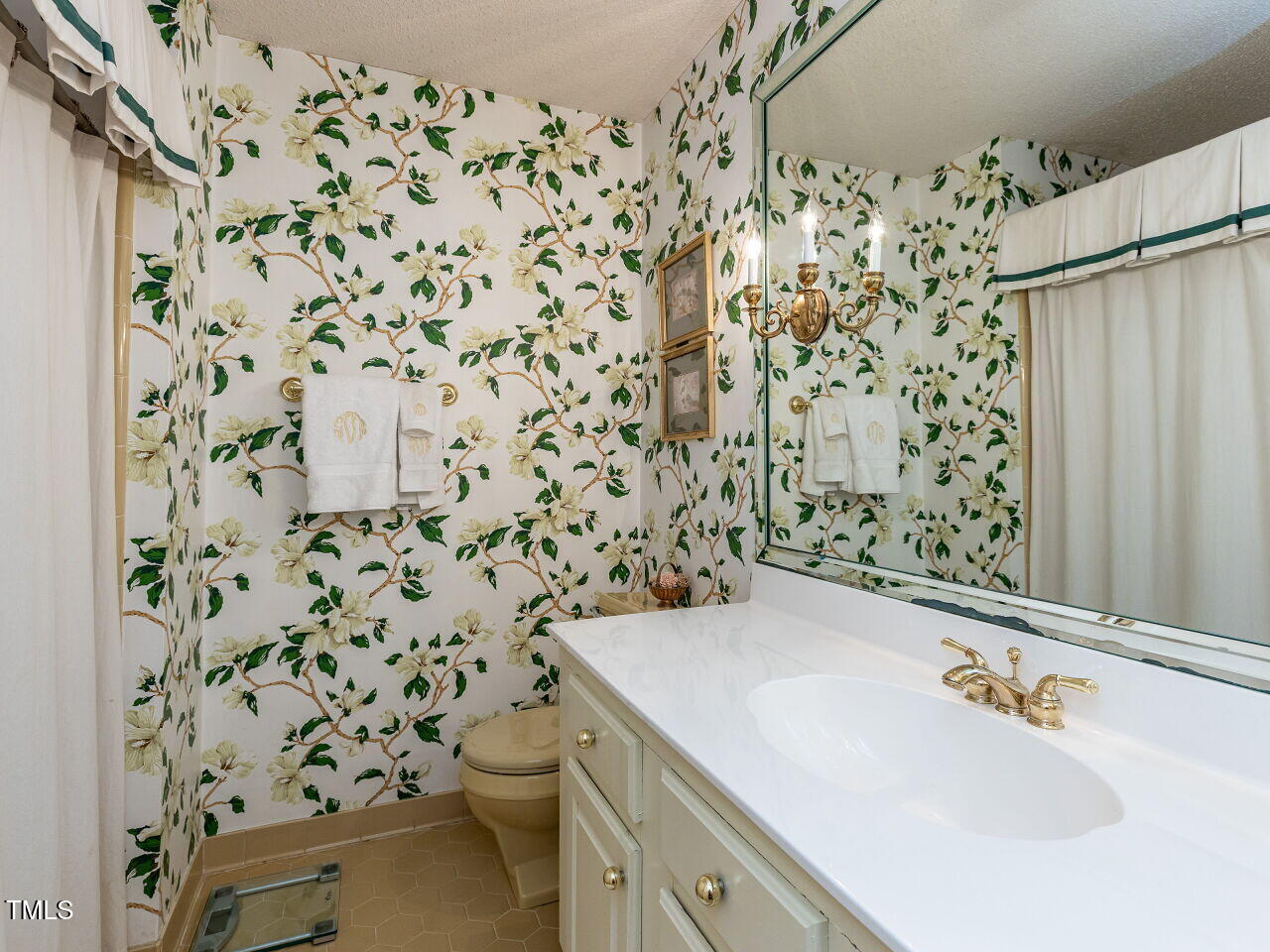 3209 Northampton Street Raleigh, NC 27609 - Photo 29 of 31 a bathroom with a sink toilet and shower