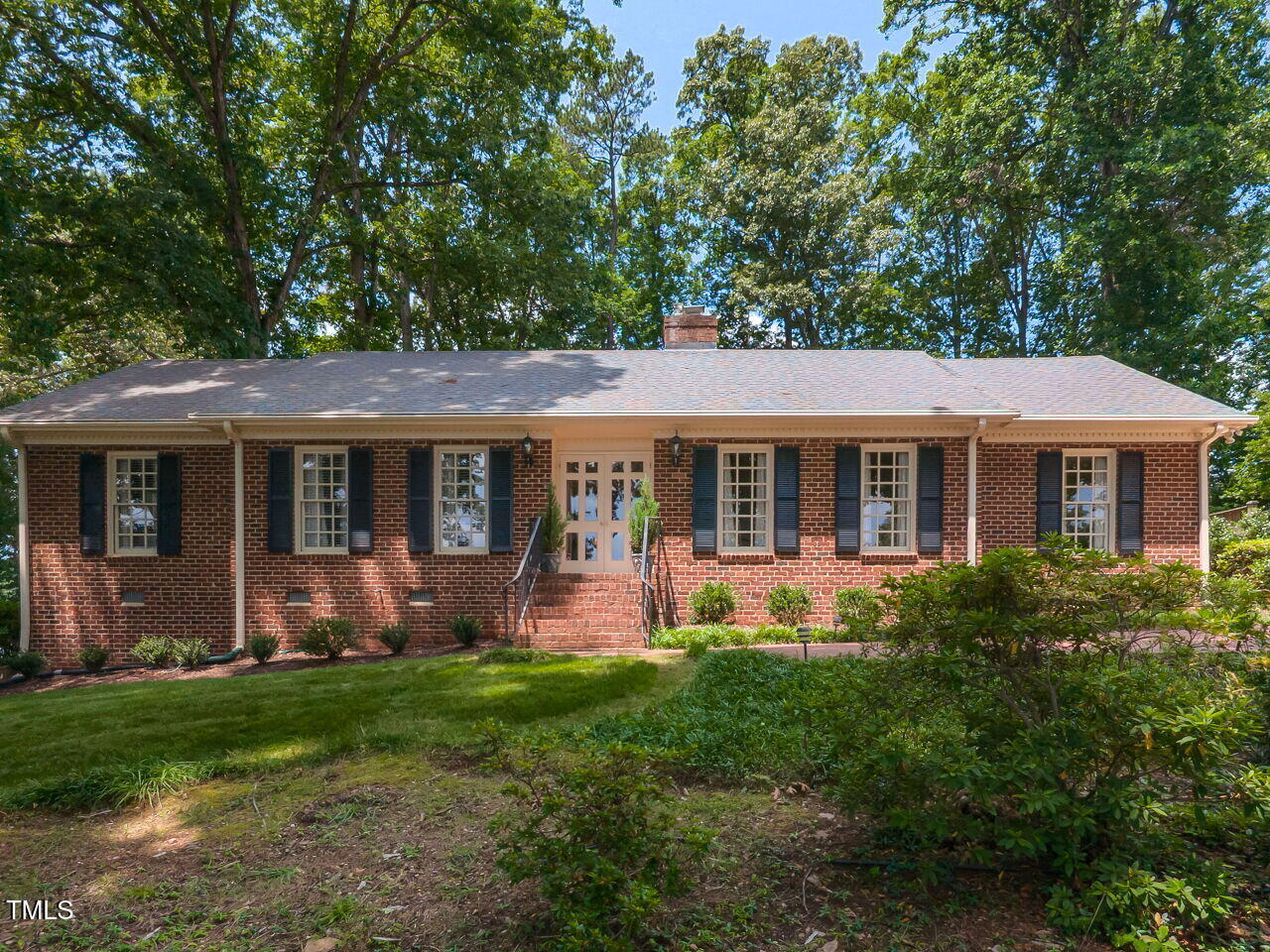 3209 Northampton Street Raleigh, NC 27609 - Photo 31 of 31 a front view of house with yard and outdoor seating
