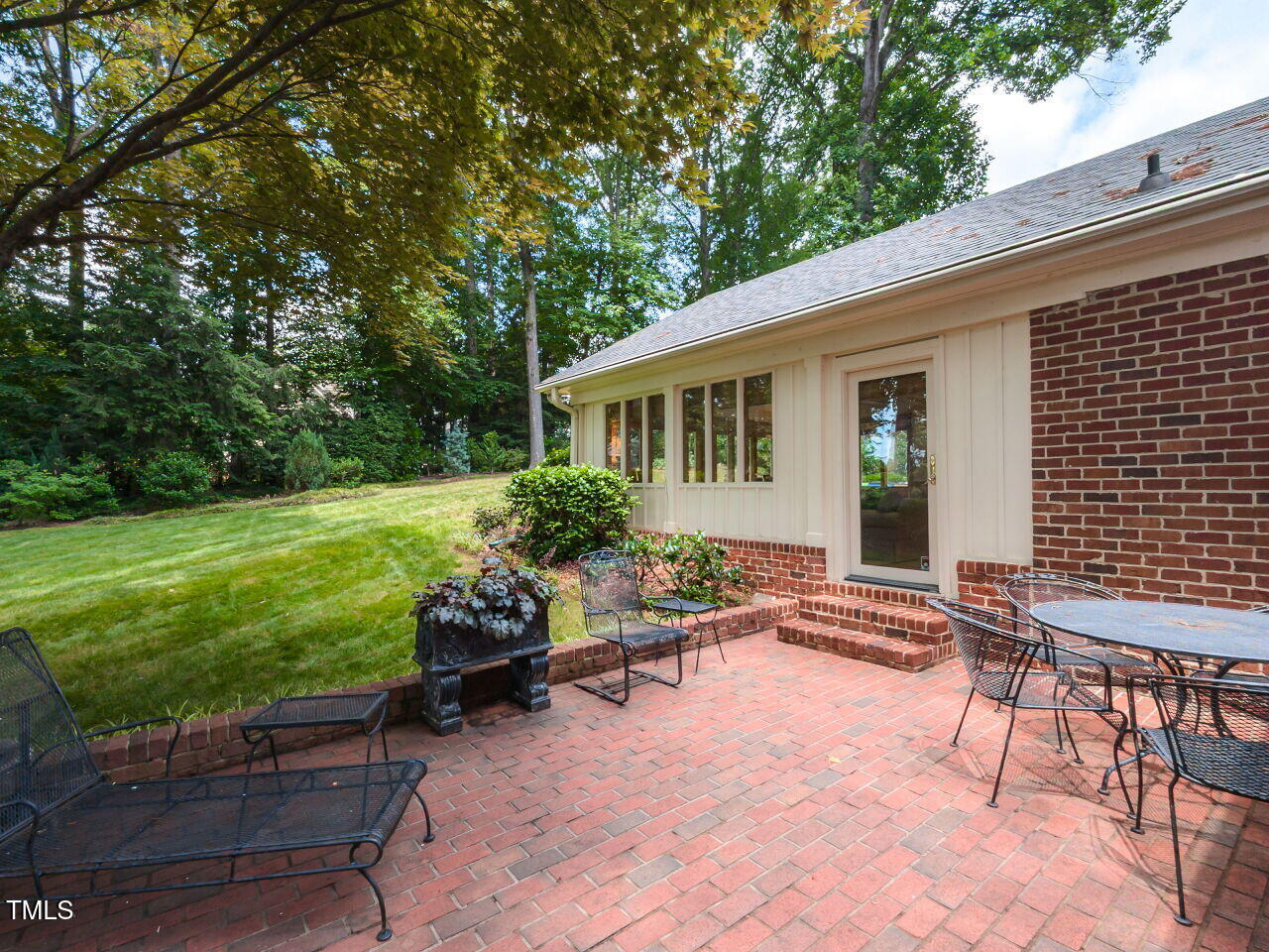 3209 Northampton Street Raleigh, NC 27609 - Photo 4 of 31 a backyard of a house with outdoor seating