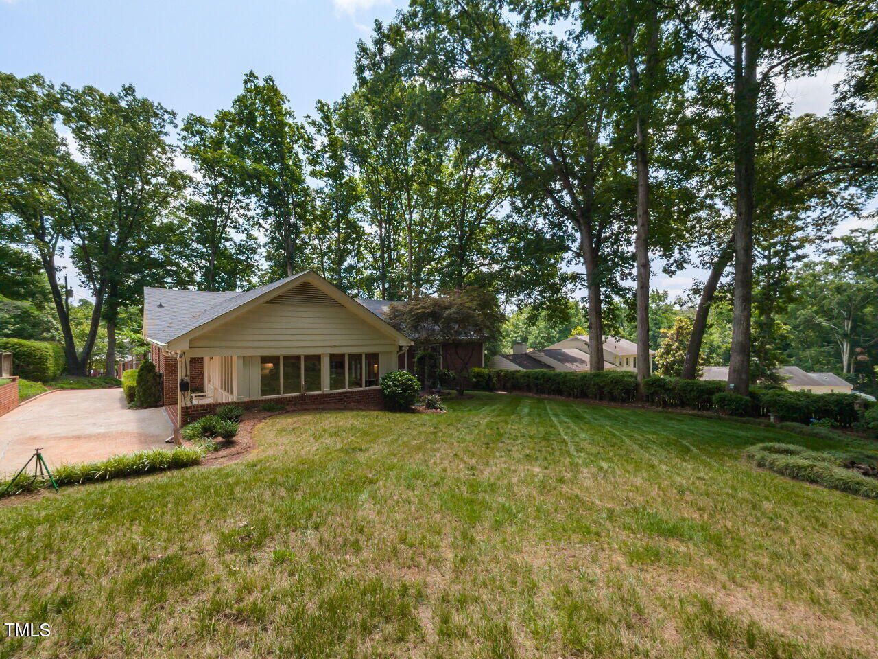 3209 Northampton Street Raleigh, NC 27609 - Photo 5 of 31 a white house that has a tree in front of it