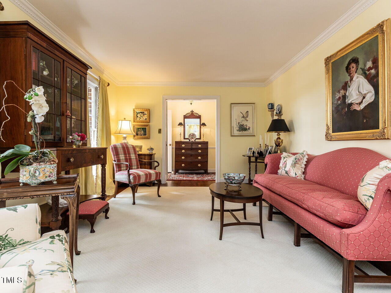 3209 Northampton Street Raleigh, NC 27609 - Photo 10 of 31 a living room with furniture and a painting on the wall
