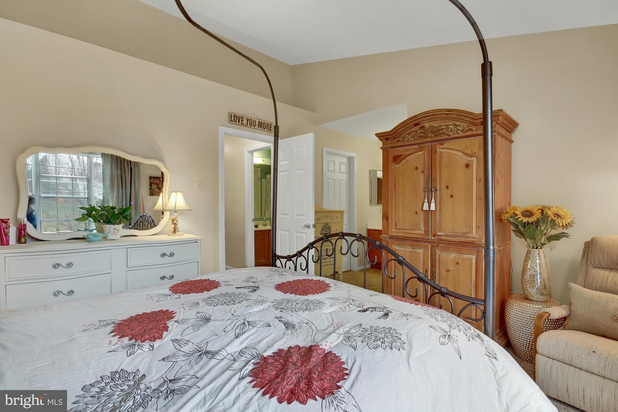 139 Gentlebrook Road Owings Mills, MD 21117 - Photo 13 of 30 a bedroom with a bed and a large mirror