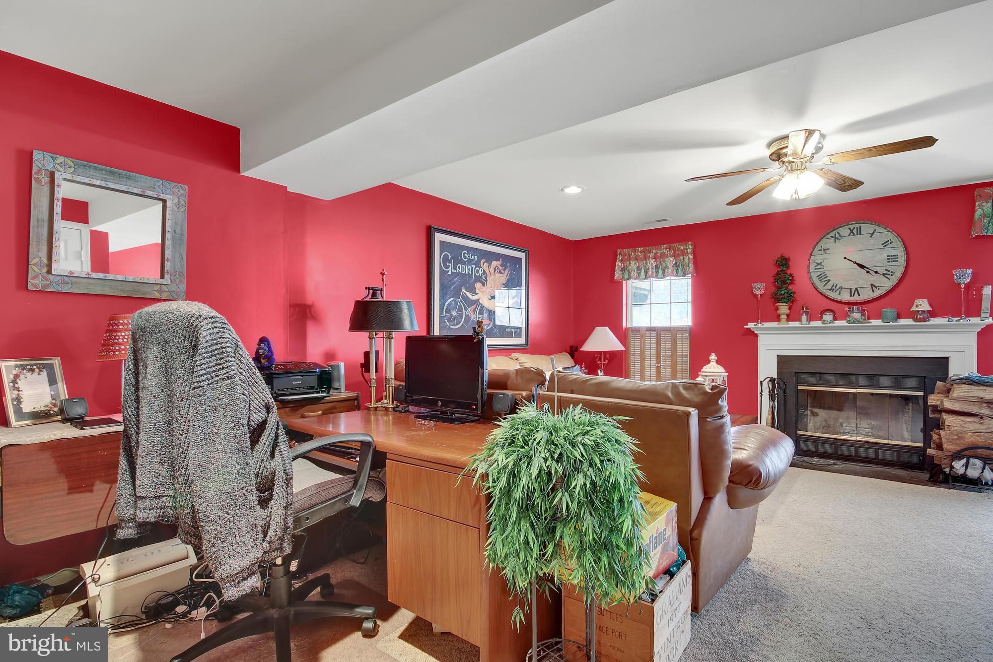 139 Gentlebrook Road Owings Mills, MD 21117 - Photo 20 of 30 a living room with furniture a fireplace and a flat screen tv