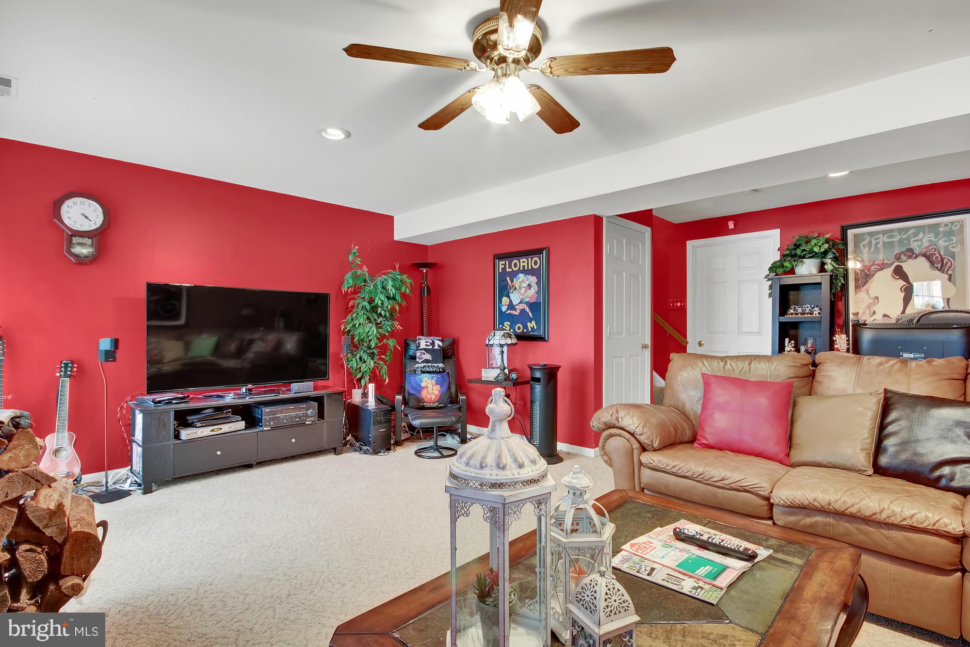 139 Gentlebrook Road Owings Mills, MD 21117 - Photo 22 of 30 a living room with furniture and a flat screen tv