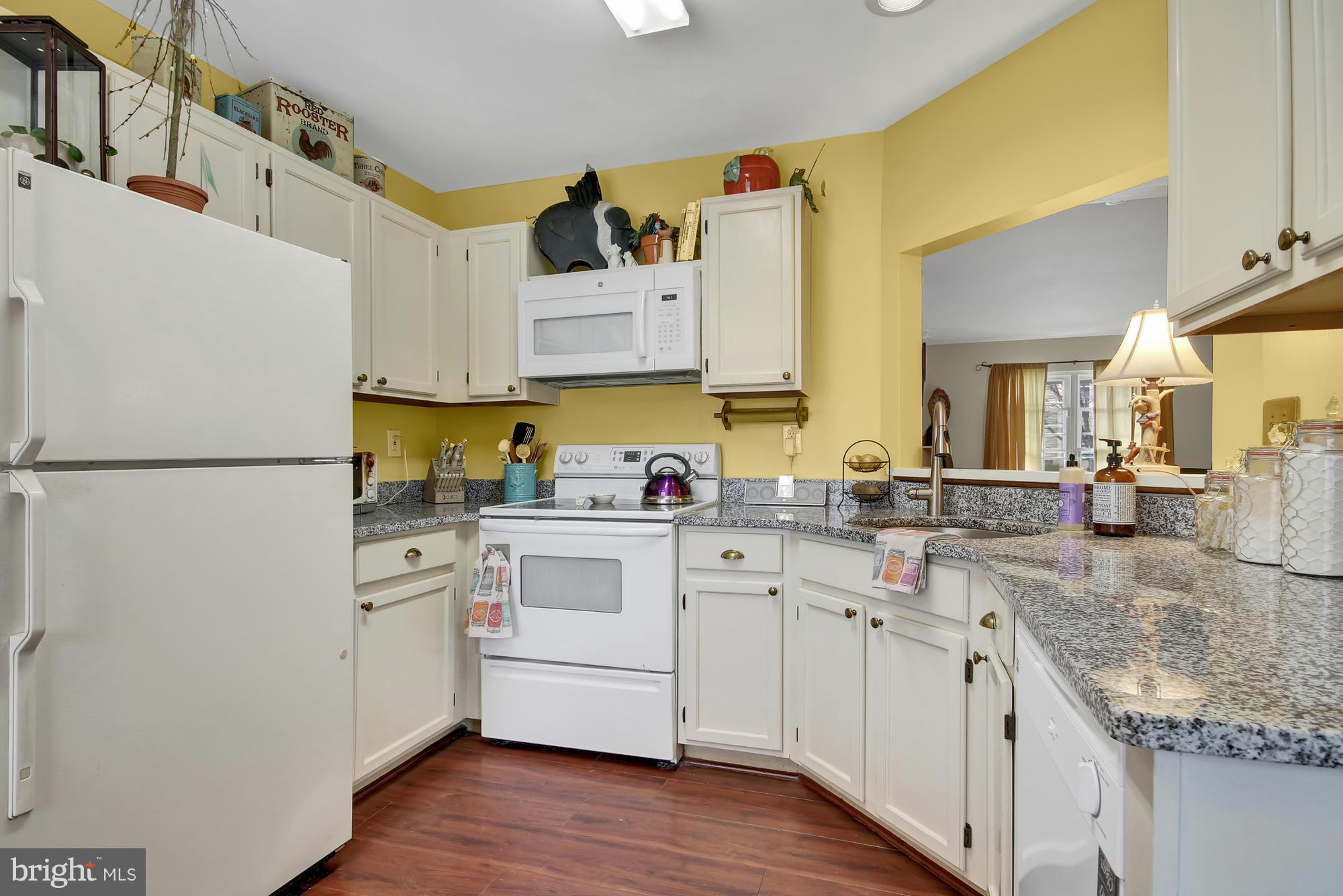 139 Gentlebrook Road Owings Mills, MD 21117 - Photo 9 of 30 a kitchen with a sink stove and refrigerator