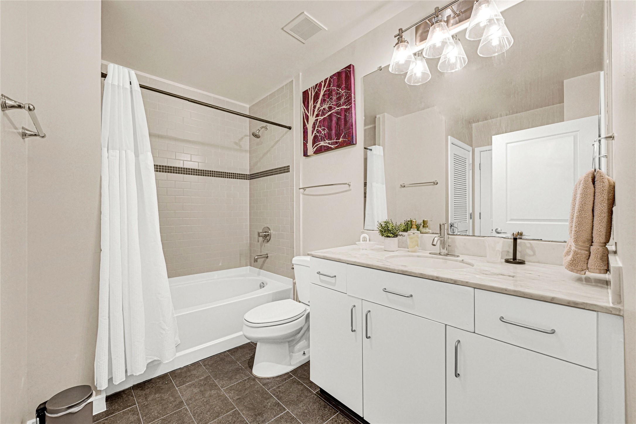 5925 Almeda Road, Unit 10806 Houston, TX 77004 - Photo 22 of 34 a bathroom with a granite countertop sink a toilet and shower