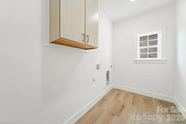 a view of an empty room and wooden floor