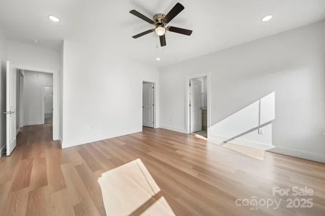 a bathroom with a sink shower and a mirror