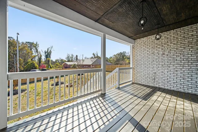 a view of front door of house with stairs