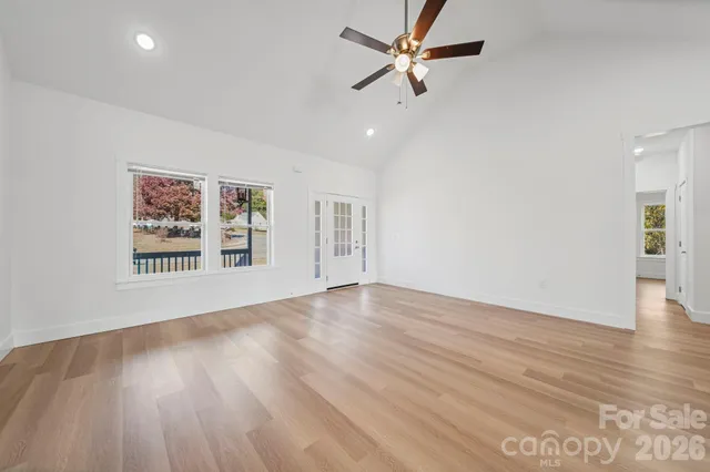 a view of a sink and cabinet with wooden floor