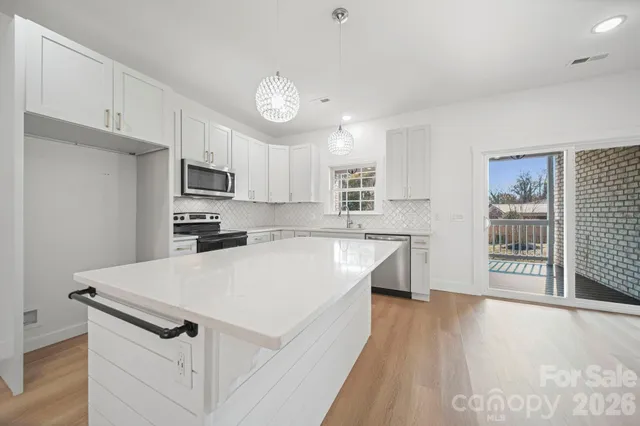 a view of a bathroom with a toilet sink and a mirror