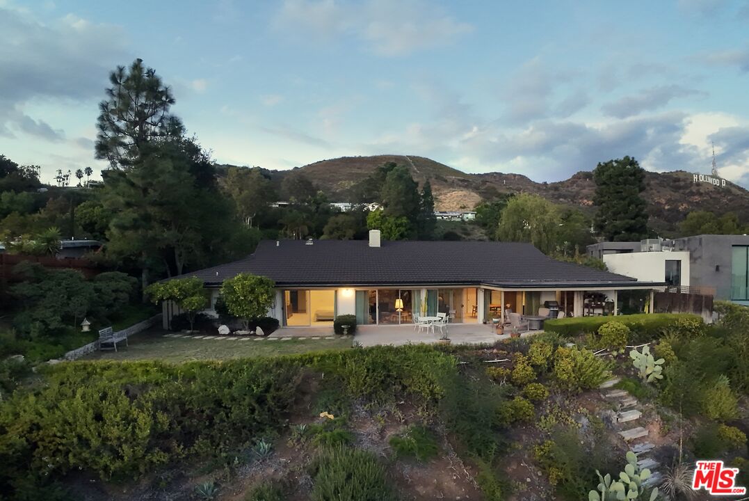 2701 Lake Hollywood Drive Los Angeles, CA 90068 - Photo 12 of 41 a front view of a house with a yard