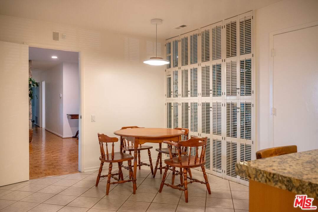 2701 Lake Hollywood Drive Los Angeles, CA 90068 - Photo 18 of 41 a dining room with furniture and window