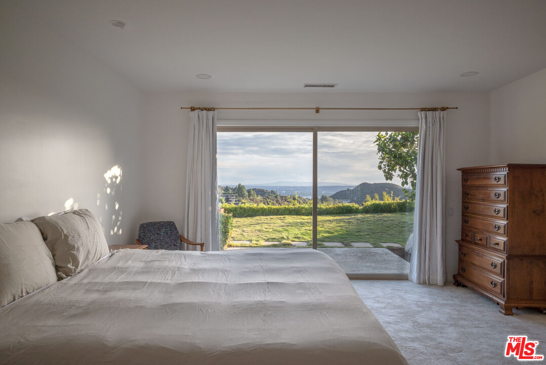 2701 Lake Hollywood Drive Los Angeles, CA 90068 - Photo 20 of 41 a view of water heater room with a floor to ceiling window