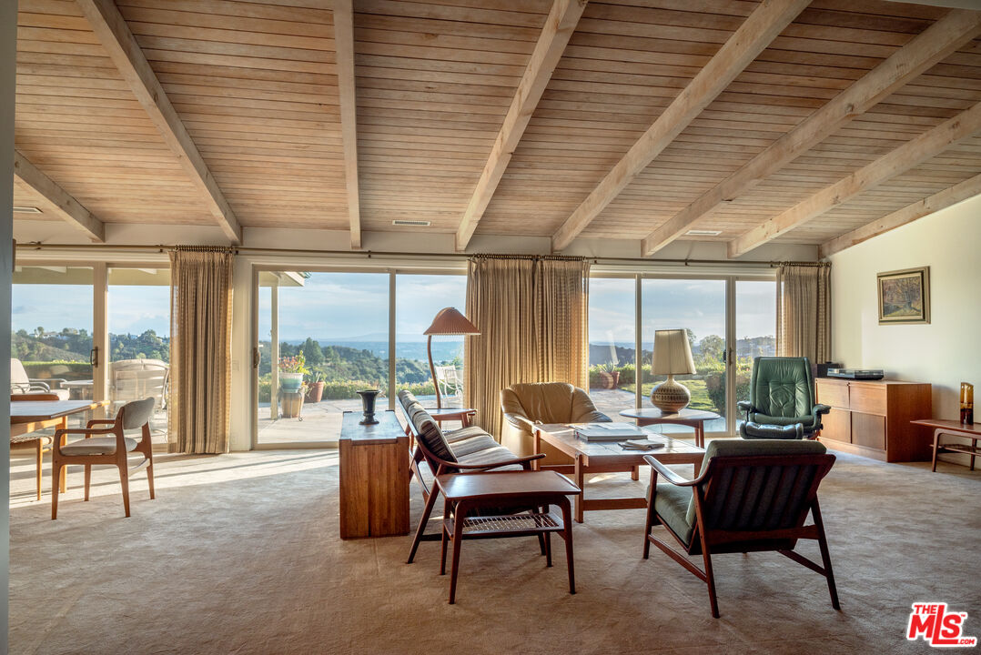 2701 Lake Hollywood Drive Los Angeles, CA 90068 - Photo 2 of 41 a living room with furniture and a large window