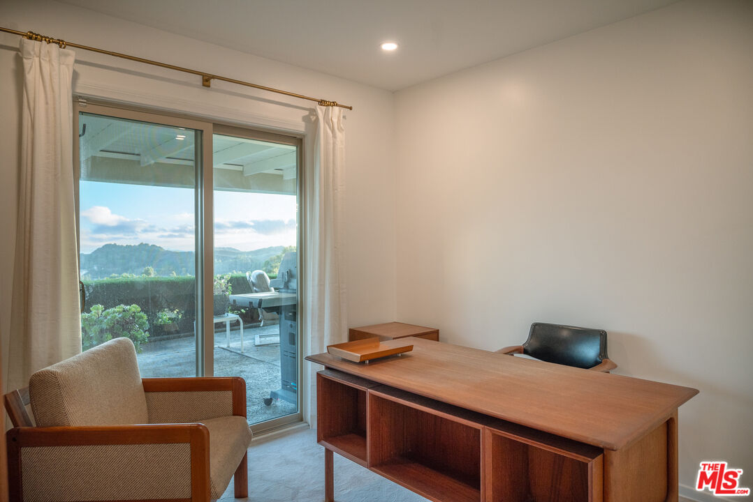 2701 Lake Hollywood Drive Los Angeles, CA 90068 - Photo 25 of 41 a room with furniture and a window