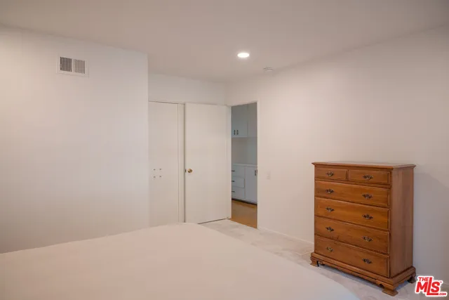 a big room with cabinet and a closet