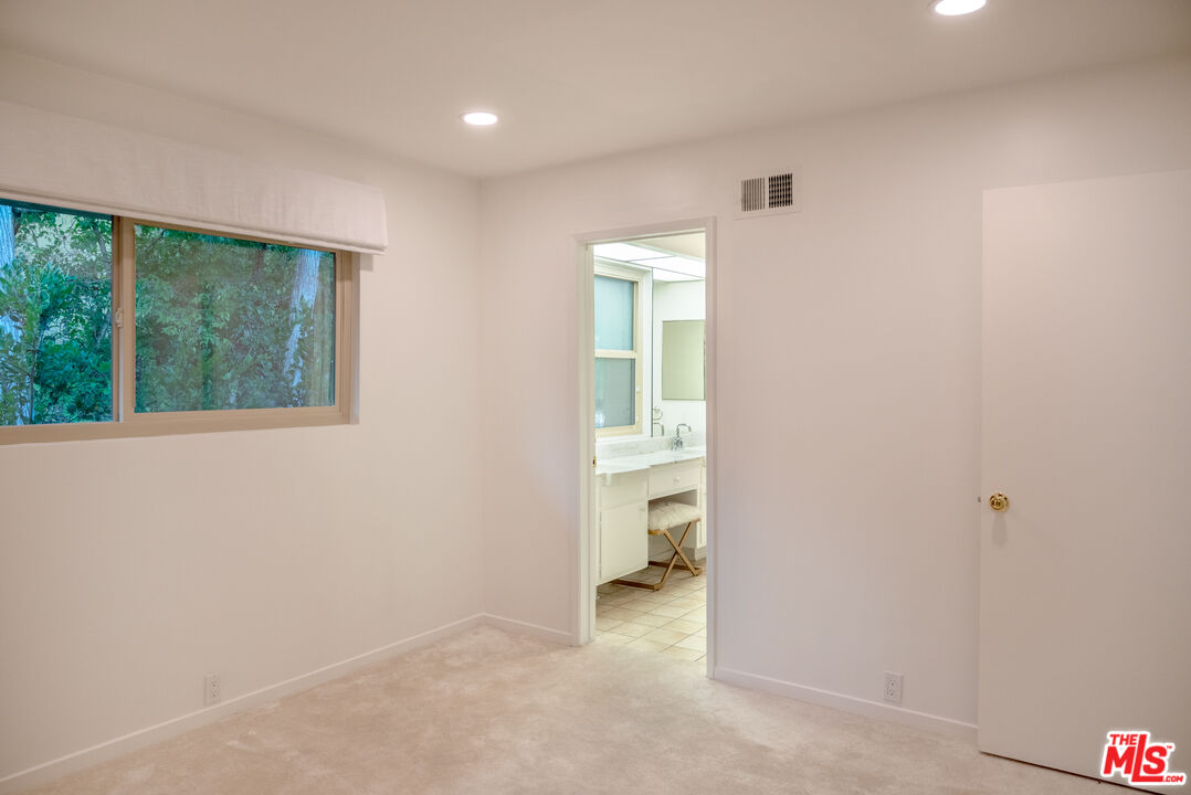 2701 Lake Hollywood Drive Los Angeles, CA 90068 - Photo 37 of 41 an empty room with a bathroom and a sink