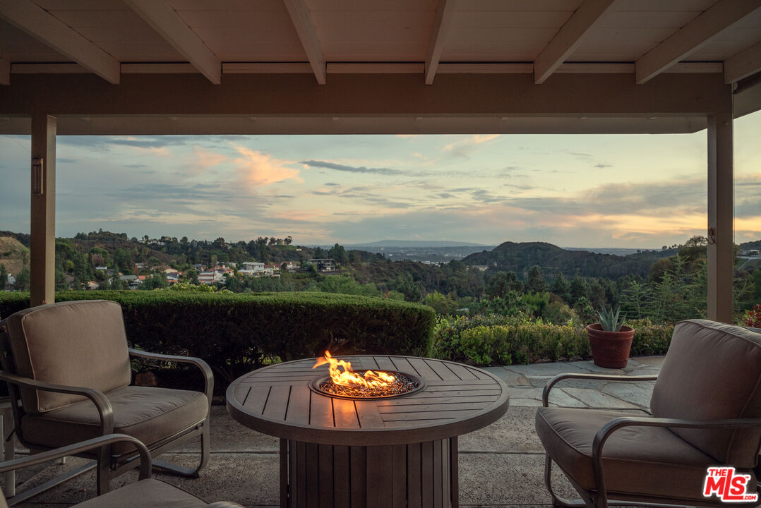 2701 Lake Hollywood Drive Los Angeles, CA 90068 - Photo 8 of 41 a view of a chairs and table in the roof