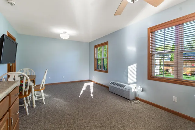 a view of a livingroom with furniture and a window