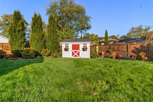 a view of a house with a back yard