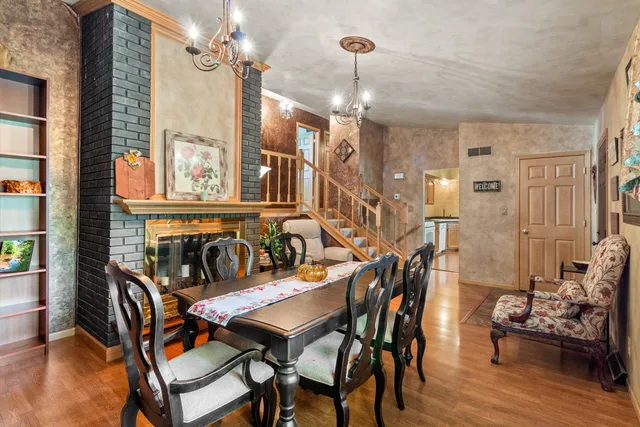 a dining room with furniture and window