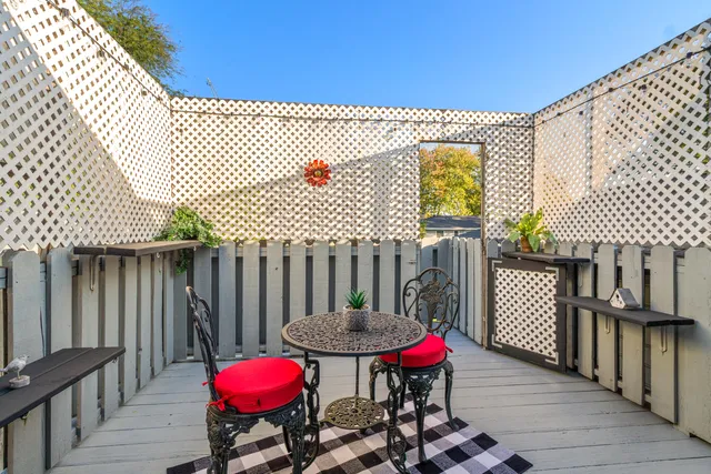 a view of a table and chairs in patio