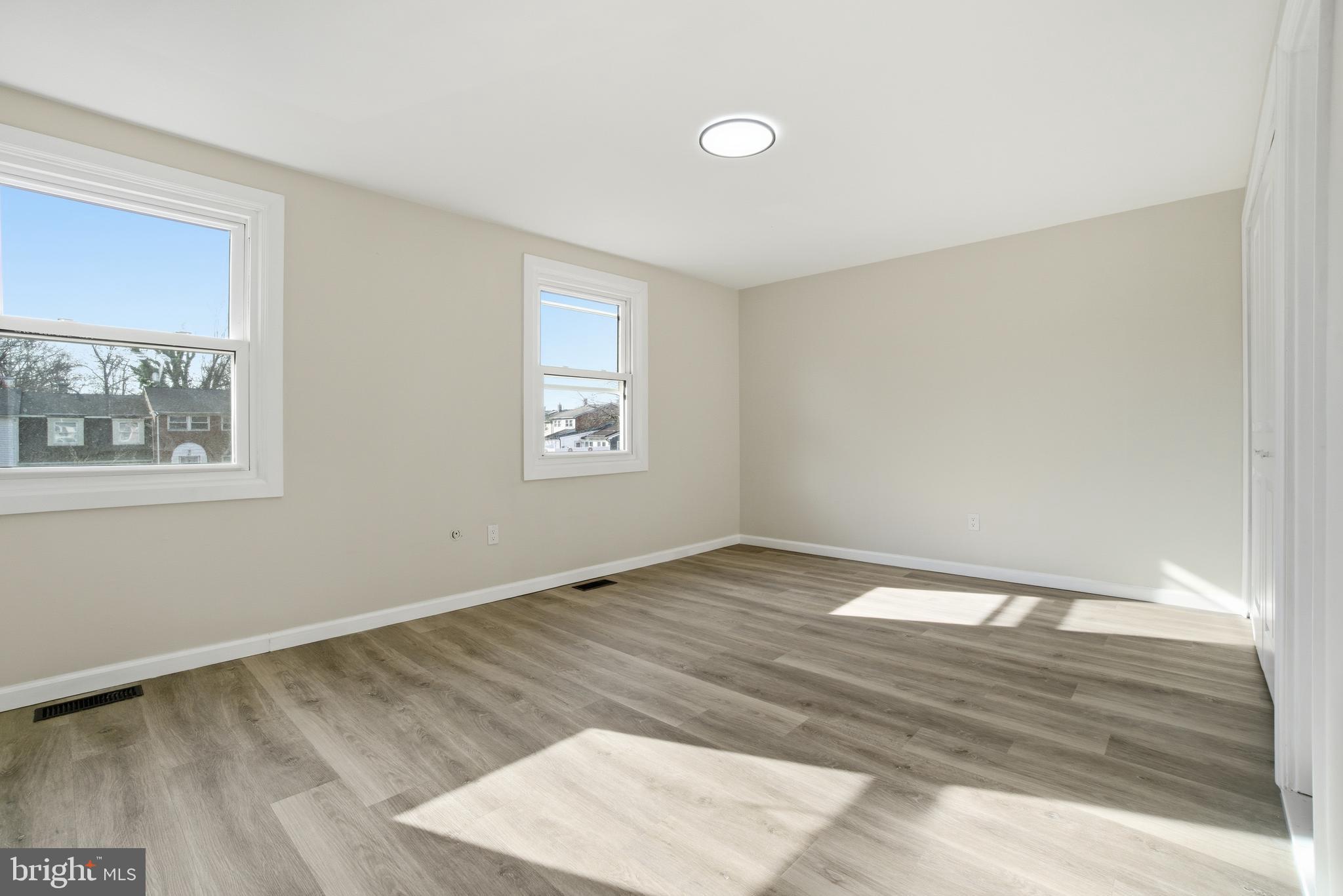 7 Riverview Place Willingboro, NJ 08046 - Photo 16 of 25 a view of an empty room with wooden floor and a window
