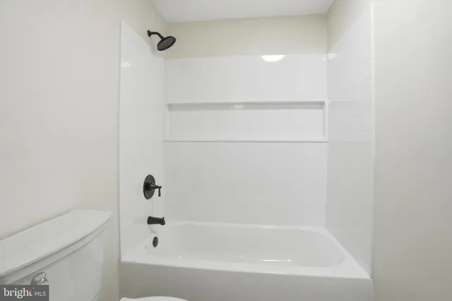 a close up of a bathtub in a bathroom