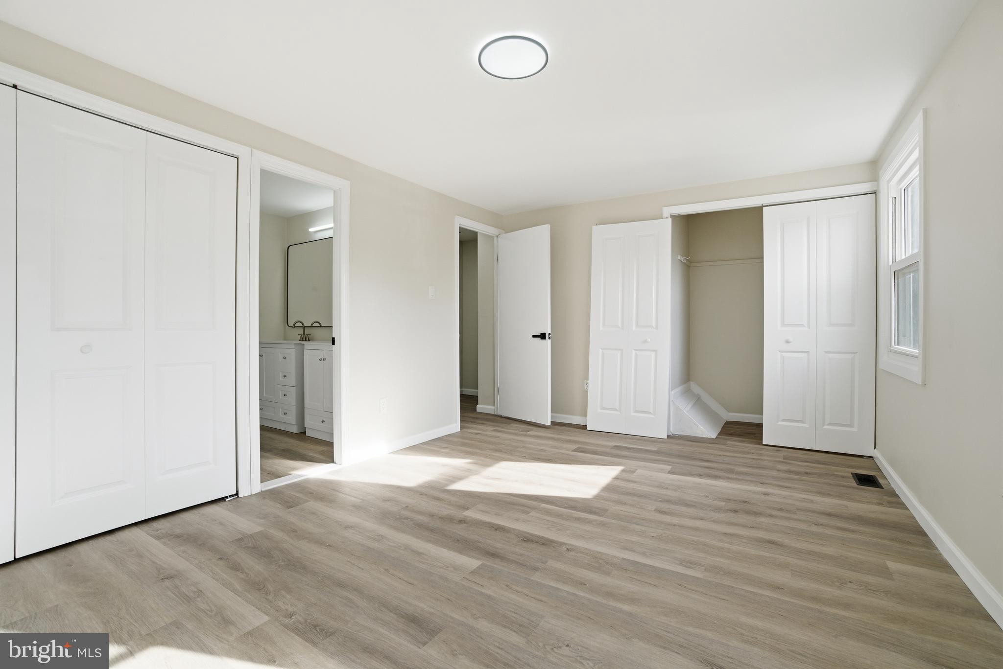 7 Riverview Place Willingboro, NJ 08046 - Photo 23 of 25 an empty room with wooden floor and closet