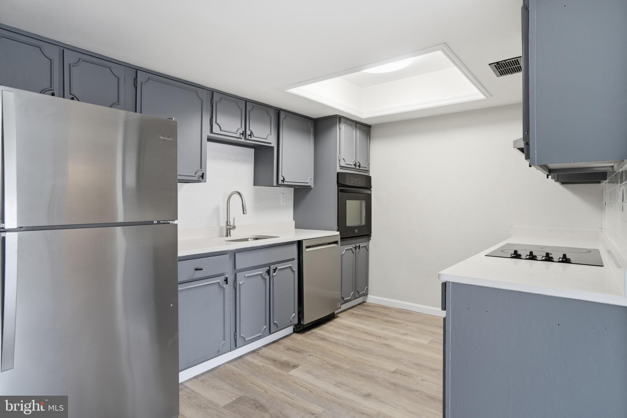 7 Riverview Place Willingboro, NJ 08046 - Photo 4 of 25 a kitchen with stainless steel appliances granite countertop a refrigerator sink and stove