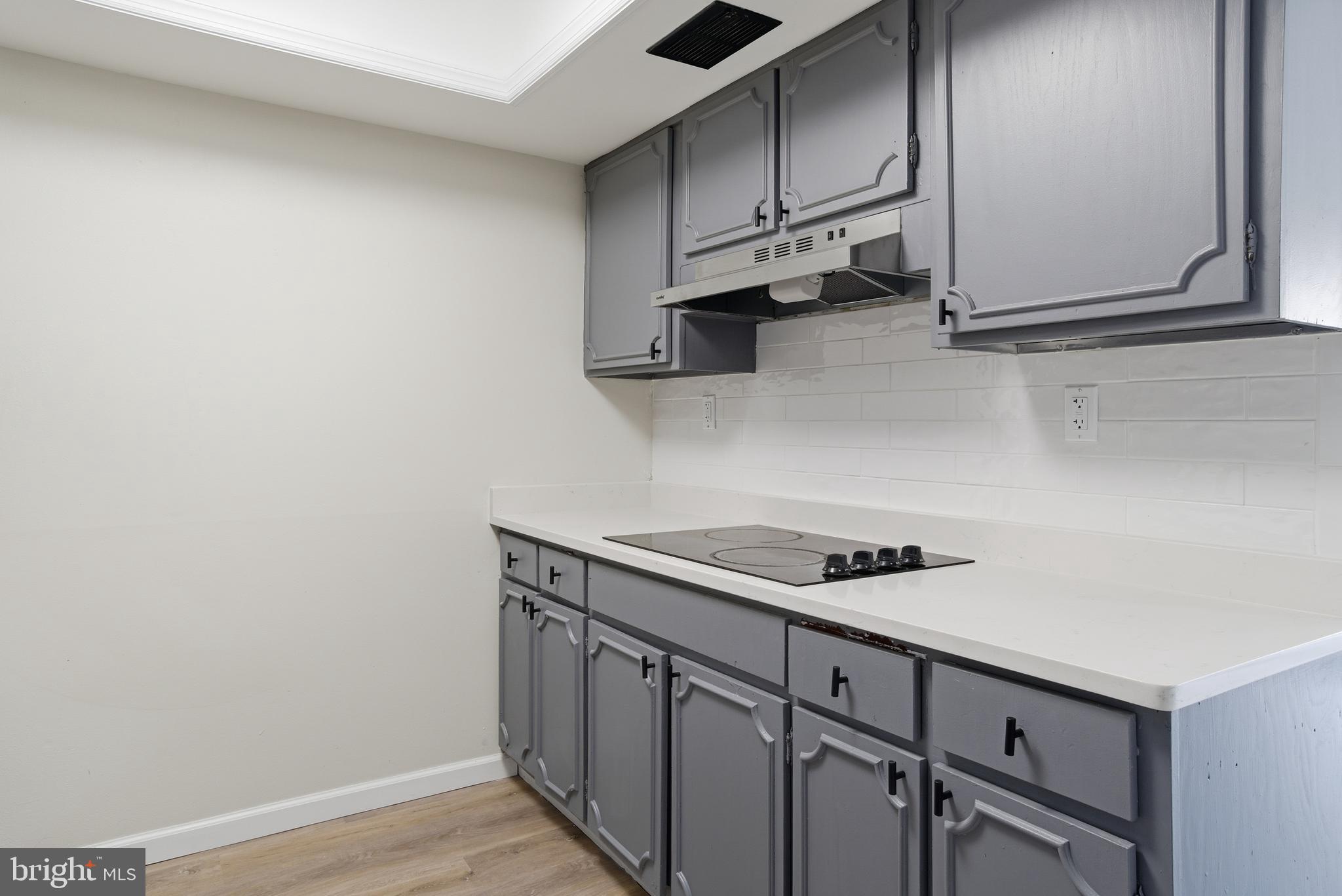 7 Riverview Place Willingboro, NJ 08046 - Photo 5 of 25 a kitchen with stainless steel appliances a sink cabinets and wooden floor