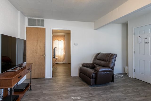 a living room with furniture a couch and a window