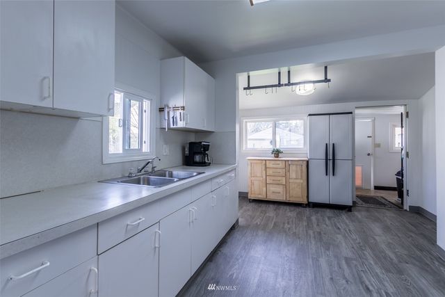 a view of cabinets and window