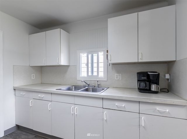a kitchen with a stove and a refrigerator