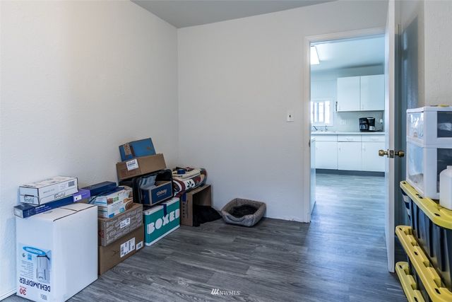 a room with furniture and a wooden floor