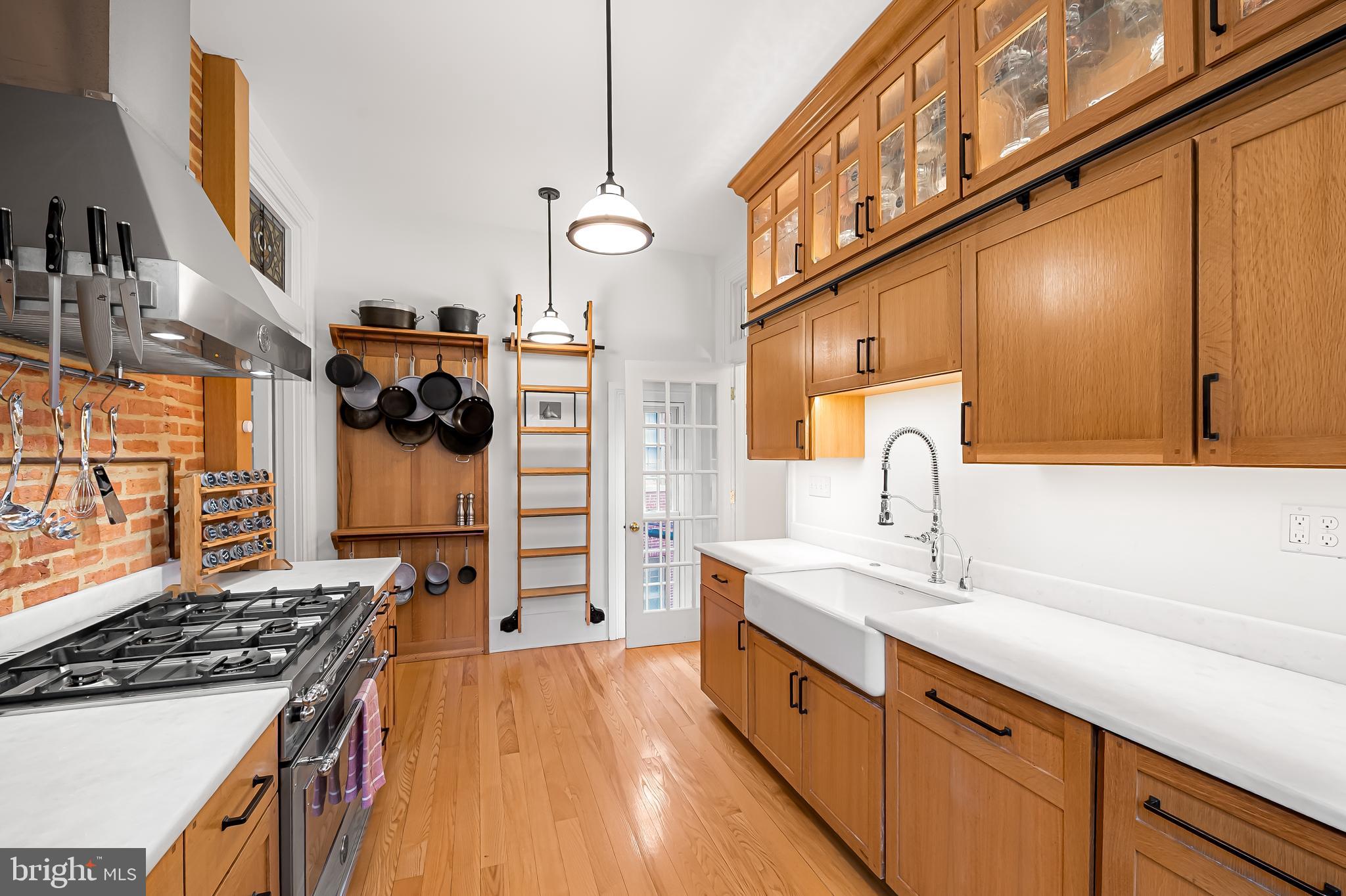 16 West Read Street Baltimore, MD 21201 - Photo 18 of 59 a kitchen with stainless steel appliances granite countertop a sink and cabinets