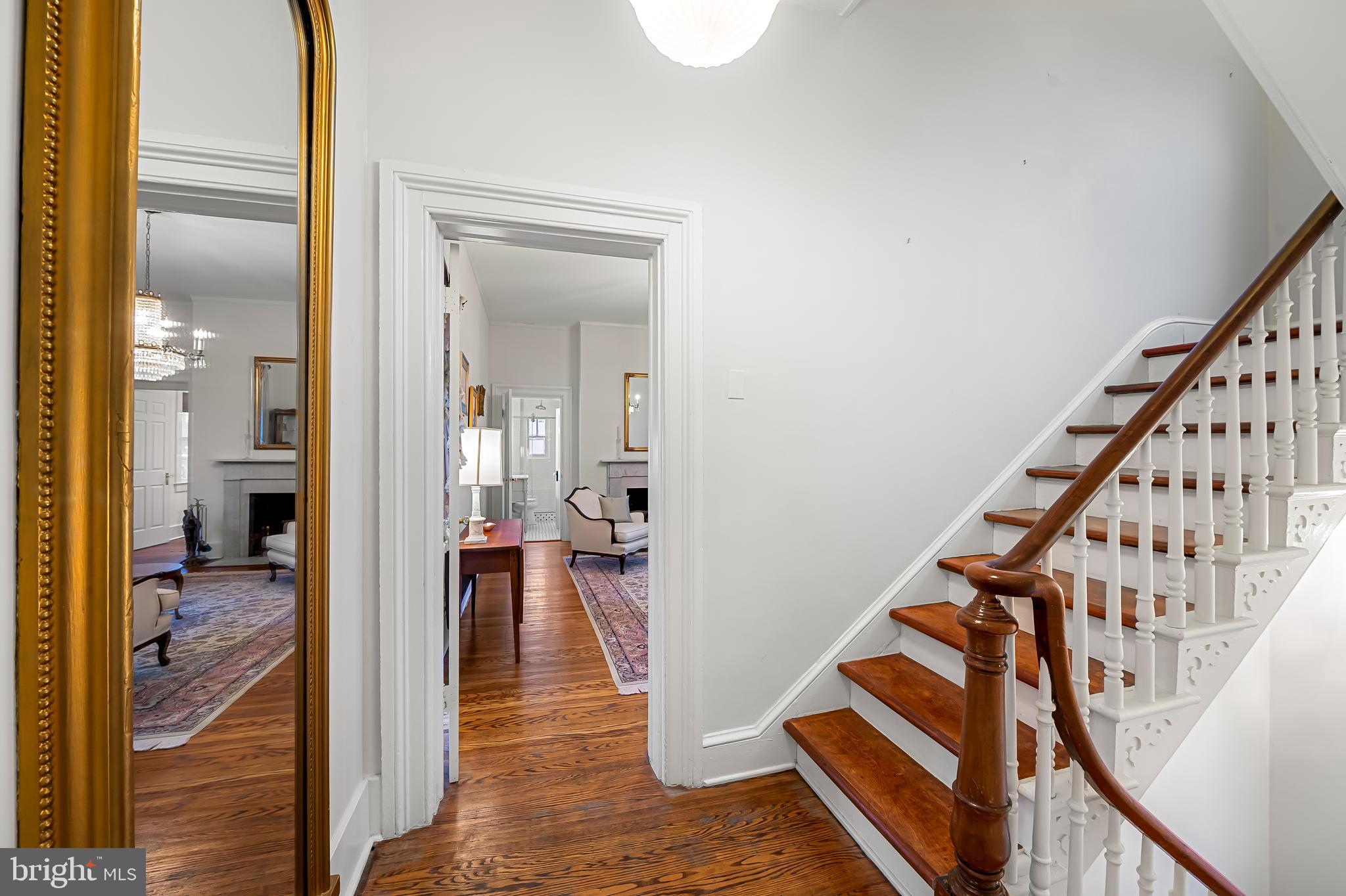 16 West Read Street Baltimore, MD 21201 - Photo 30 of 59 a view of a hallway with wooden floor windows and a livingroom