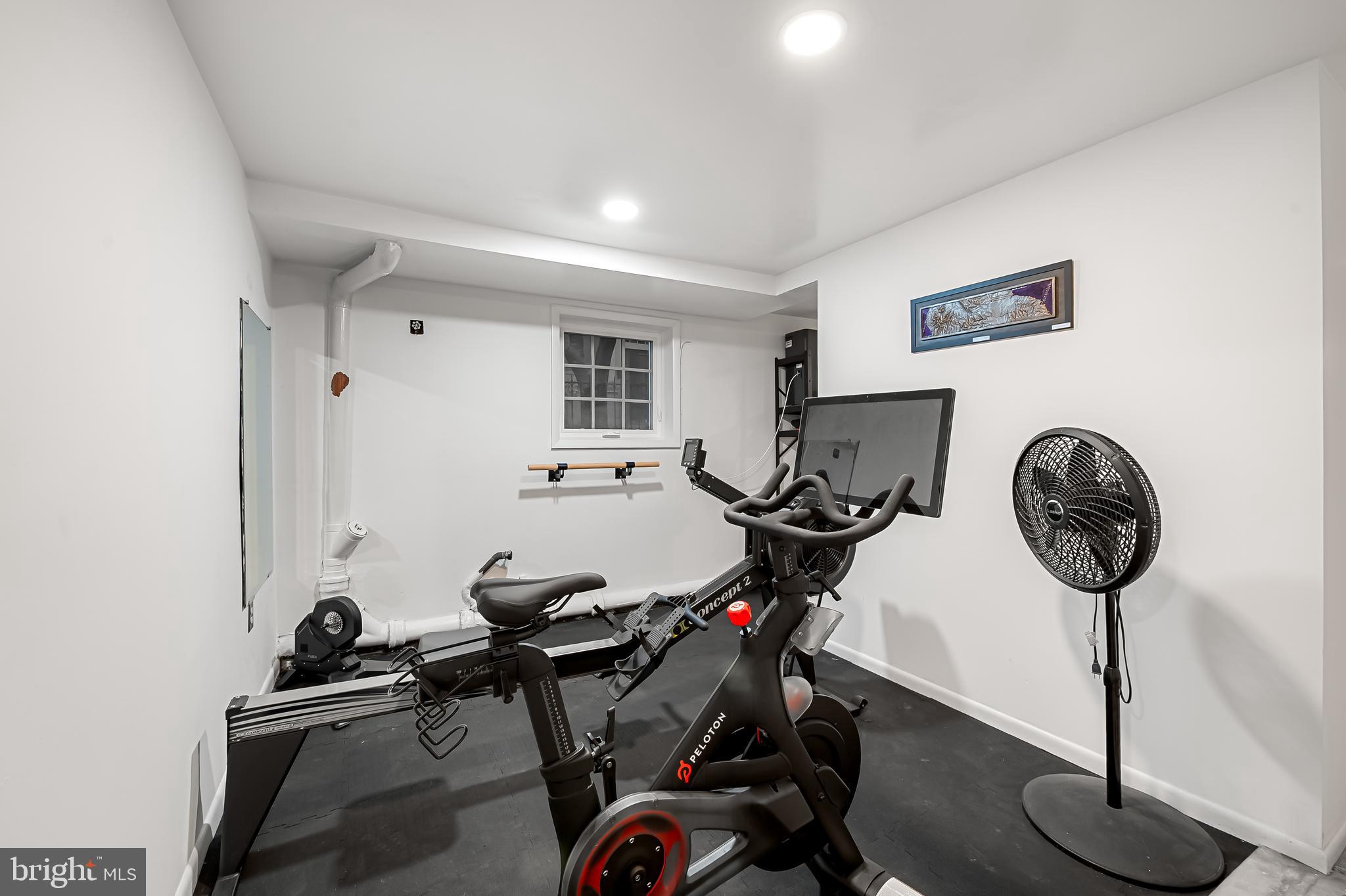 16 West Read Street Baltimore, MD 21201 - Photo 39 of 59 a room with gym equipment and a view of living room