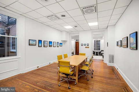 a view of a dining room with furniture and window