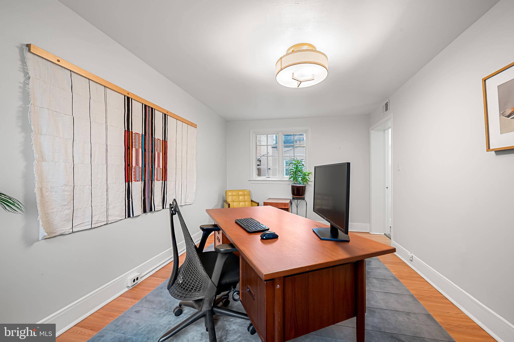16 West Read Street Baltimore, MD 21201 - Photo 10 of 59 a view of a workspace with furniture and a window