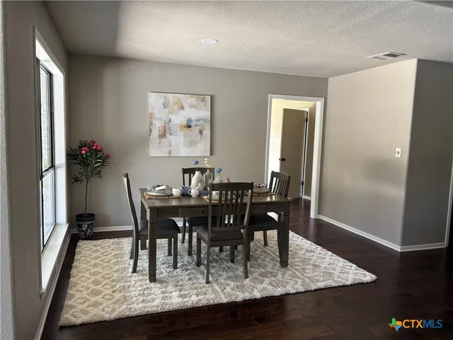 a view of a dining room with furniture