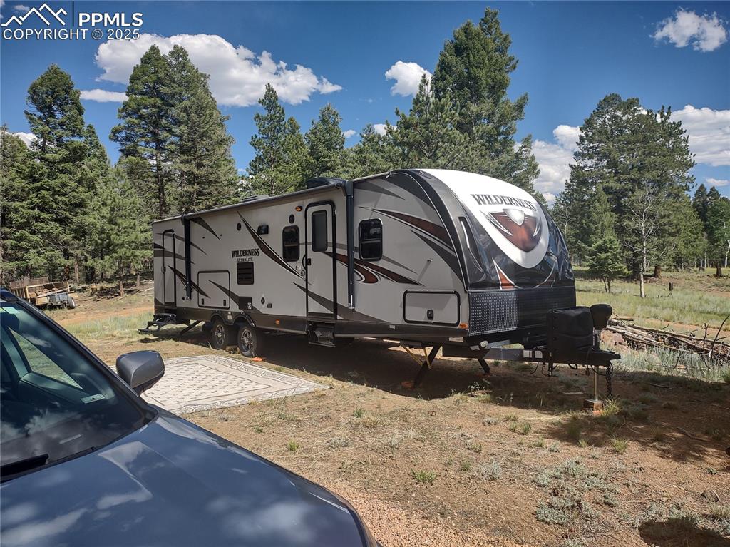1176 Trail Creek Road Lake George, CO 80827 - Photo 29 of 48 a view of a house with a yard