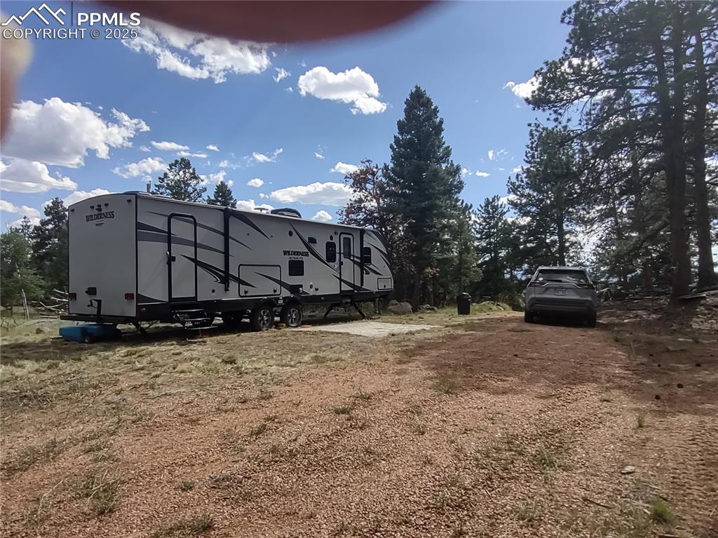 1176 Trail Creek Road Lake George, CO 80827 - Photo 33 of 48 a view of a house with a yard