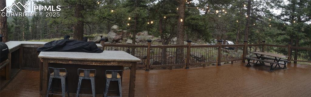 1176 Trail Creek Road Lake George, CO 80827 - Photo 44 of 48 a view of a dinning table and chairs in patio