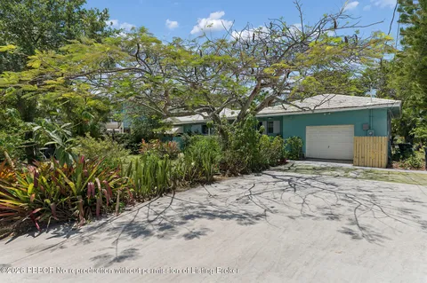 a view of a house with a tree