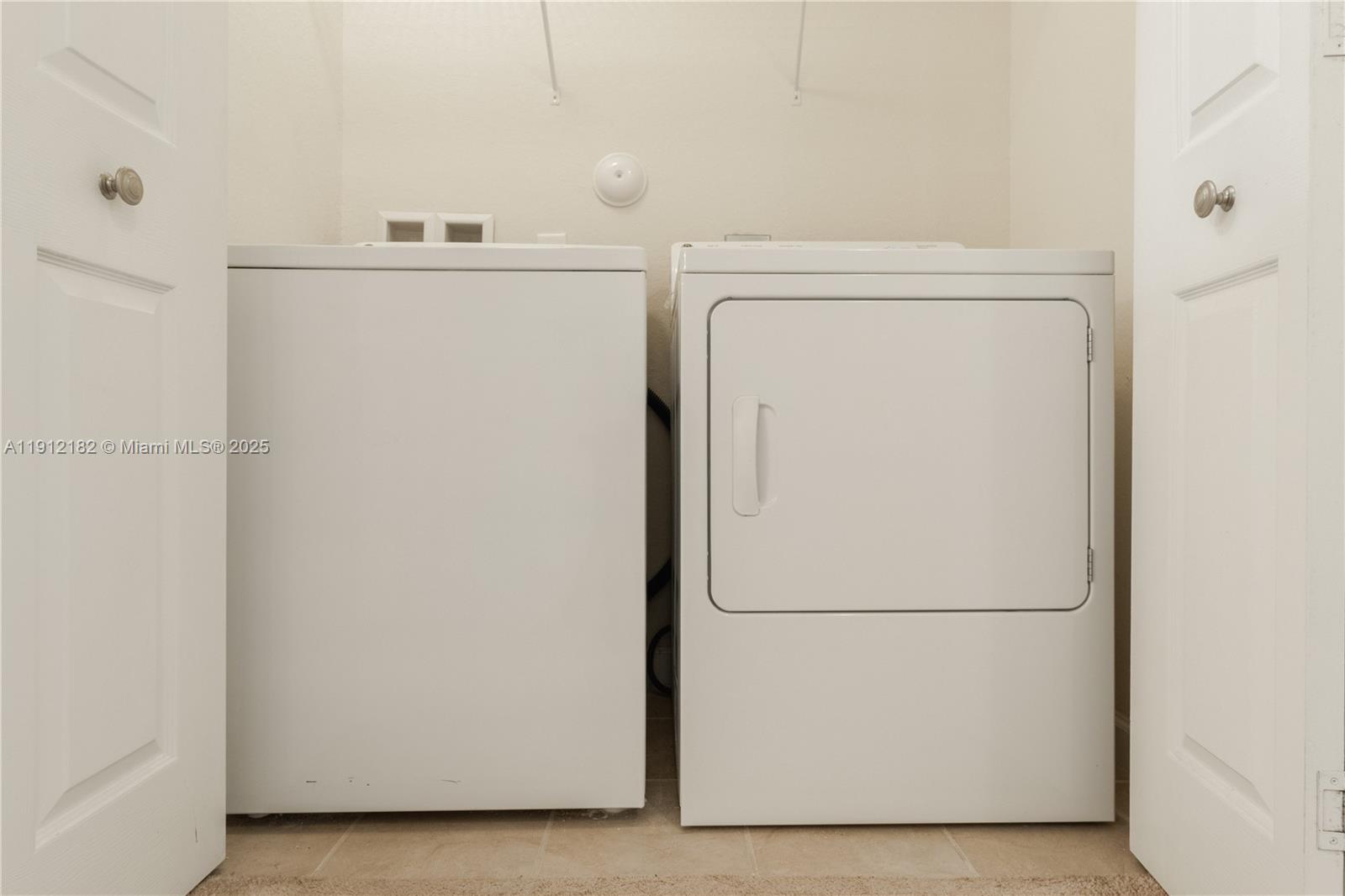 9045 West 33rd Avenue, Unit 9045 Hialeah, FL 33018 - Photo 20 of 23 a view of washer and dryer